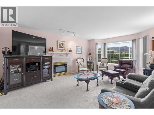 280 Cosens Court, Kelowna, BC - Indoor Photo Showing Living Room With Fireplace
