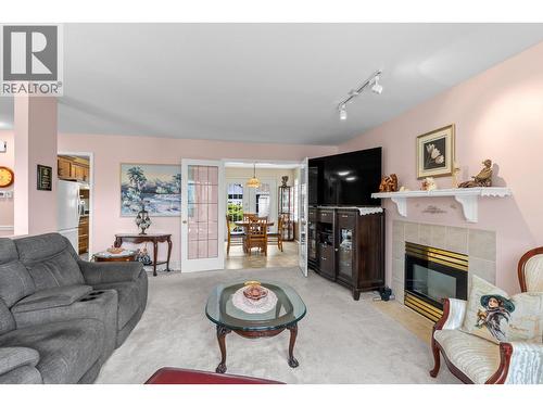 280 Cosens Court, Kelowna, BC - Indoor Photo Showing Living Room With Fireplace