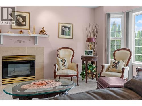 280 Cosens Court, Kelowna, BC - Indoor Photo Showing Living Room With Fireplace