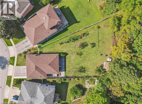 Expansive parcel featuring two distinct properties, extensive green space, and mature trees bordering the property line - 42 Azores Crescent, Cambridge, ON - Outdoor With View