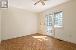 Main floor bedroom #1 with walk out to backyard - 