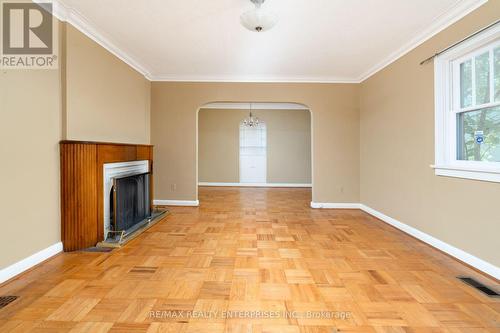 Main floor living room with wood burning fireplace - 52 Briarwood Avenue, Mississauga, ON - Indoor Photo Showing Other Room With Fireplace