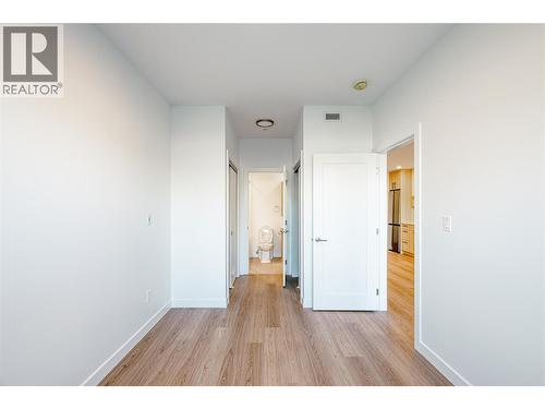 Primary Bedroom, walkthrough closets into bathroom. Photo from similar unit. - 1380 Pridham Avenue Unit# 314, Kelowna, BC - Indoor Photo Showing Other Room