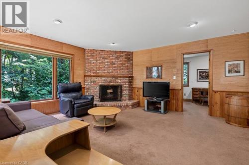 family room with lots of space to relax - 44 Colquhoun Crescent, Hamilton, ON - Indoor Photo Showing Living Room With Fireplace