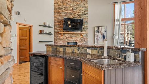 1802 Greywolf Drive, Panorama, BC - Indoor Photo Showing Kitchen With Fireplace