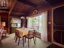 Separate dining area with view of wooded valley. - 