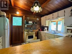 Enter the vaulted ceiling cottage. - 