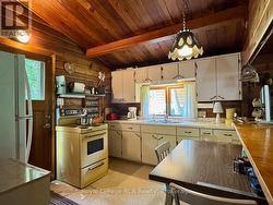 Ample size kitchen with double sink & eating area. - 