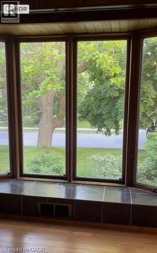 Bay window featuring wood-frame windows, a tiled window seat, and wood-finish flooring - 48 Austin Drive Unit# Upper, Waterloo, ON - Indoor Photo Showing Other Room