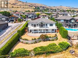Perched on this tiered lawn, on a quiet cul-de-sac, over-looking Okanagan Lake. - 