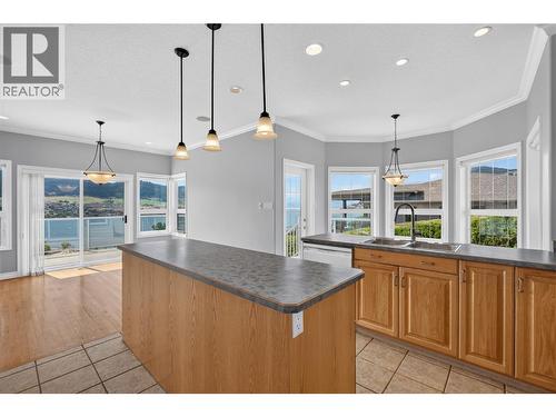 Large, eat-in kitchen with nook and full dining room. - 7083 Jasper Drive, Vernon, BC - Indoor Photo Showing Kitchen With Double Sink