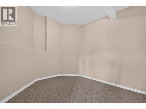 Lower level flex space behind bar room. Perfect for media room, wine tasting room, or man cave. - 7083 Jasper Drive, Vernon, BC - Indoor Photo Showing Other Room
