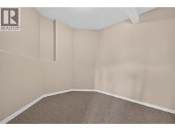 Lower level flex space behind bar room. Perfect for media room, wine tasting room, or man cave. - 