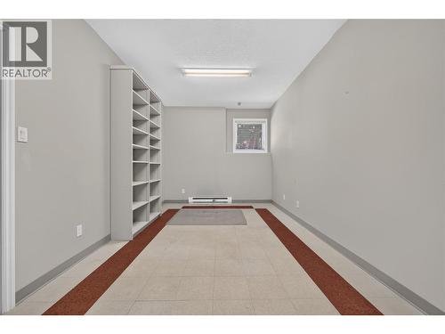 The perfect space for a home-based business. With utility sink, extensive built-in shelving, and ample workspace. - 7083 Jasper Drive, Vernon, BC - Indoor Photo Showing Other Room