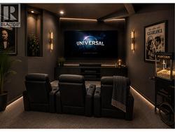 Lower level flex space virtually reimagined as home theatre room. - 
