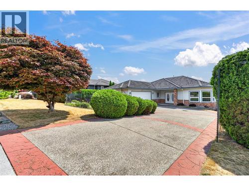 Beautifully landscaped yards. - 7083 Jasper Drive, Vernon, BC - Outdoor