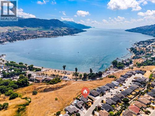 Steps from Kin Beach, lake access, and walking trails including the Grey Canal Trail. - 7083 Jasper Drive, Vernon, BC - Outdoor With Body Of Water With View