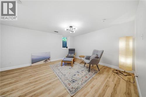 Neutral white walls with wood-finish flooring - 80 Jackson Avenue, Kitchener, ON - Indoor