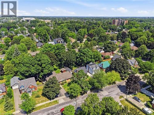 Aerial view of a residential neighborhood with extensive tree canopies, residential streets, and diverse architectural styles - 80 Jackson Avenue, Kitchener, ON - Outdoor With View