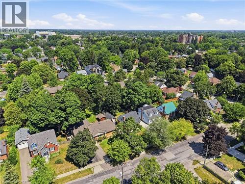 Aerial perspective of a tree-lined residential area featuring a variety of architectural styles, established landscaping, and urban infrastructure - 80 Jackson Avenue, Kitchener, ON - Outdoor With View