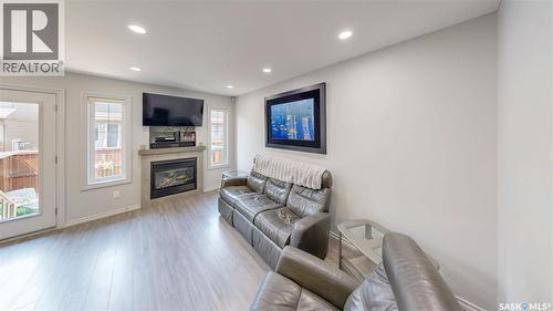 134 4100 Sandhill Crescent, Regina, SK - Indoor Photo Showing Living Room With Fireplace