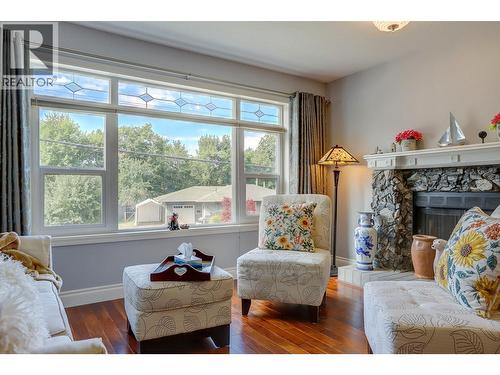 8405 Postill Drive, Coldstream, BC - Indoor Photo Showing Living Room With Fireplace