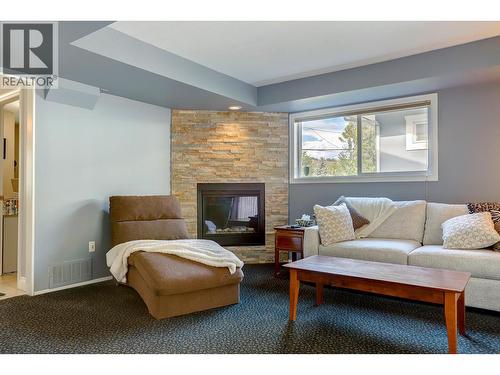 8405 Postill Drive, Coldstream, BC - Indoor Photo Showing Living Room With Fireplace