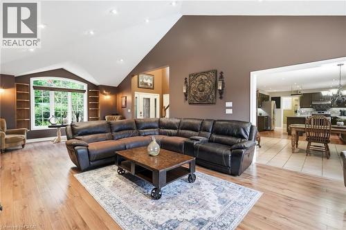 Spacious living area featuring high vaulted ceilings, wood-finish flooring, and recessed lighting - 5 Manor Crescent, Grimsby, ON - Indoor Photo Showing Living Room