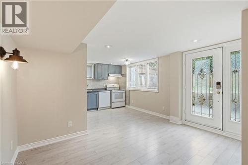Dinette to Kitchen in 2 Bedroom In-Law Suite with Walkout doors to backyard. - 5 Manor Crescent, Grimsby, ON - Indoor Photo Showing Other Room