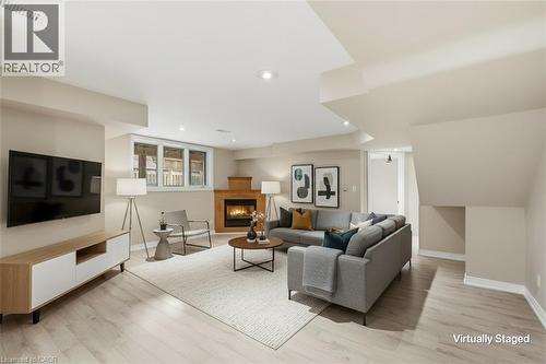 In-Law Suite  Virtually Staged - 5 Manor Crescent, Grimsby, ON - Indoor Photo Showing Living Room With Fireplace