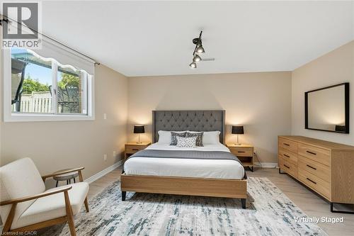 In-Law Suite Bedroom Virtually Staged - 5 Manor Crescent, Grimsby, ON - Indoor Photo Showing Bedroom