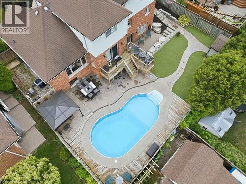 Backyard oasis featuring an in-ground pool, expansive wood decking, brick paver patio, and a gazebo - 5 Manor Crescent, Grimsby, ON - Outdoor With In Ground Pool