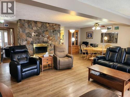 242 Dawson Drive, Faro, YT - Indoor Photo Showing Living Room With Fireplace
