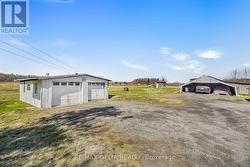 Double detached garage and older shed. - 