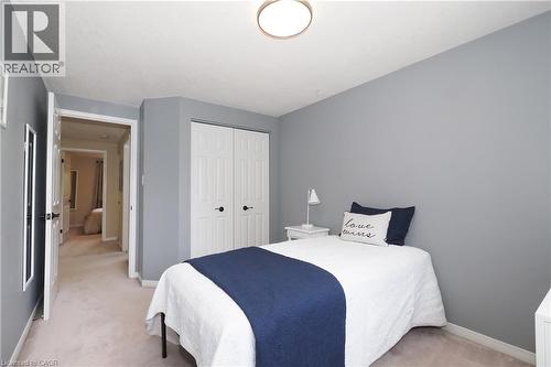 Carpeted room with light grey walls and white trim - 218 Inverhuron Crescent Unit# A, Waterloo, ON - Indoor Photo Showing Bedroom
