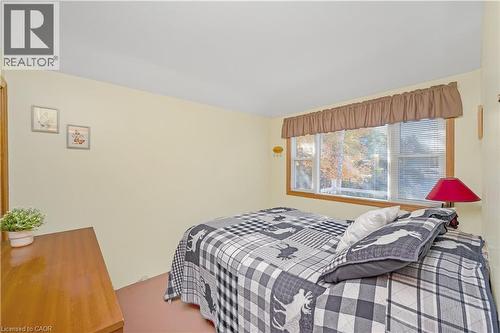 Primary Bedroom with view of the water - 1012 Armstrong Road, Gravenhurst, ON - Indoor Photo Showing Bedroom