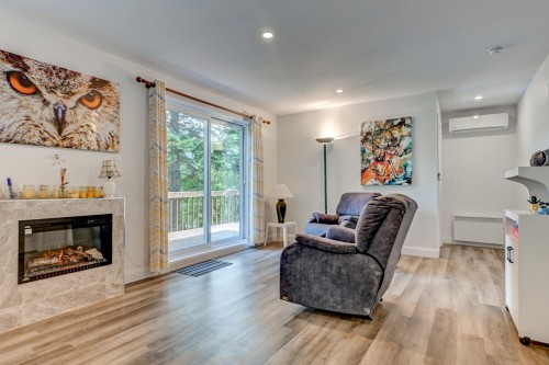 Salon - 16 Ch. Du Lac-Adair, Saint-Hippolyte, QC - Indoor Photo Showing Living Room With Fireplace