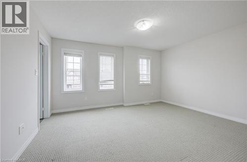 Spacious room with light-toned walls and neutral-toned carpeting - 823 Paris Boulevard, Waterloo, ON - Indoor Photo Showing Other Room
