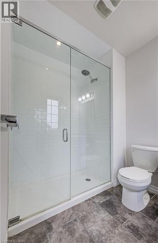 Glass-enclosed shower with white subway tile surround, single showerhead, and recessed lighting - 823 Paris Boulevard, Waterloo, ON - Indoor Photo Showing Bathroom