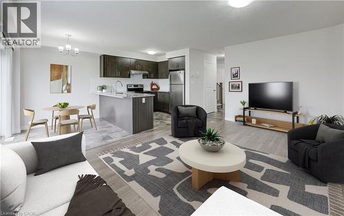 Open-concept living space featuring wood-finish flooring, a contemporary kitchen with dark cabinetry, stainless steel appliances, and a central island with countertop seating - 823 Paris Boulevard, Waterloo, ON - Indoor Photo Showing Living Room