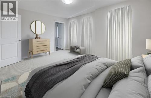 Light-toned walls complement the neutral carpet flooring - 823 Paris Boulevard, Waterloo, ON - Indoor Photo Showing Bedroom