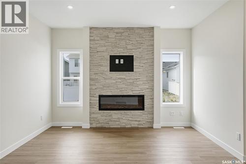 692 Nazarali Lane, Saskatoon, SK - Indoor Photo Showing Living Room With Fireplace