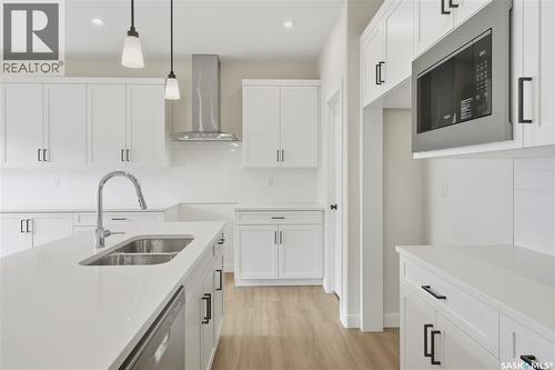 692 Nazarali Lane, Saskatoon, SK - Indoor Photo Showing Kitchen With Double Sink With Upgraded Kitchen