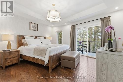Primary with private balcony and WIC - 30 Stephen Road, Muskoka Lakes (Medora), ON - Indoor Photo Showing Bedroom
