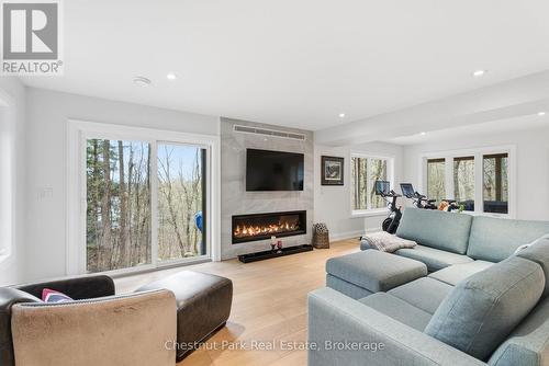 Heated flooring throughout - 30 Stephen Road, Muskoka Lakes (Medora), ON - Indoor Photo Showing Living Room With Fireplace