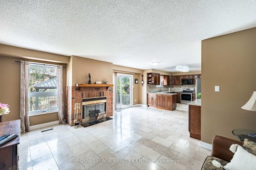 3211 Dovetail Mews, Mississauga, ON - Indoor Photo Showing Living Room With Fireplace
