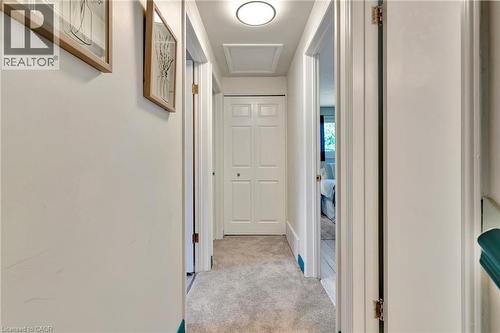 Hallway featuring light-colored carpeting, white walls, and a round flush-mount ceiling light - 98 Belwood Crescent, Kitchener, ON - Indoor Photo Showing Other Room