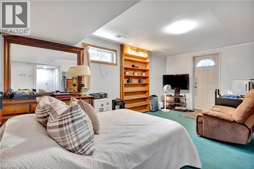 Finished room featuring built-in shelving, recessed ceiling light, and a window - 98 Belwood Crescent, Kitchener, ON - Indoor Photo Showing Other Room