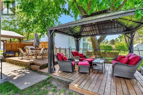 Multi-level wood deck featuring a covered gazebo with string lighting - 98 Belwood Crescent, Kitchener, ON - Outdoor With Deck Patio Veranda With Exterior