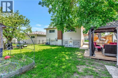Spacious rear yard with a wooden deck featuring a built-in gazebo - 98 Belwood Crescent, Kitchener, ON - Outdoor